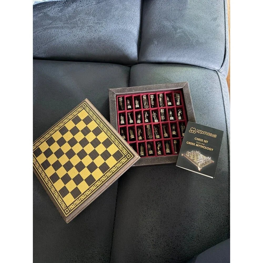 manopoulos chess set with Greek mythology pieces and guide.